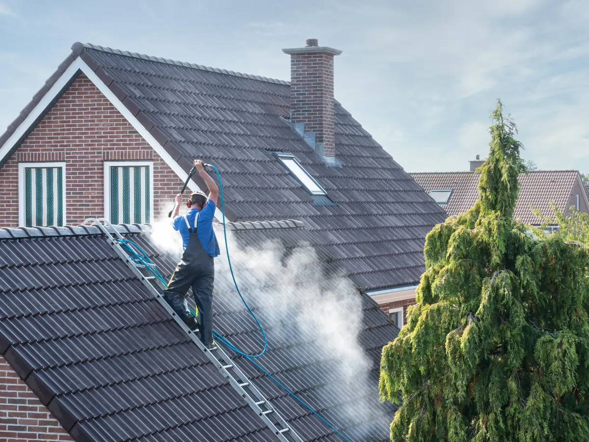 Close view of roof cleaning work in progress